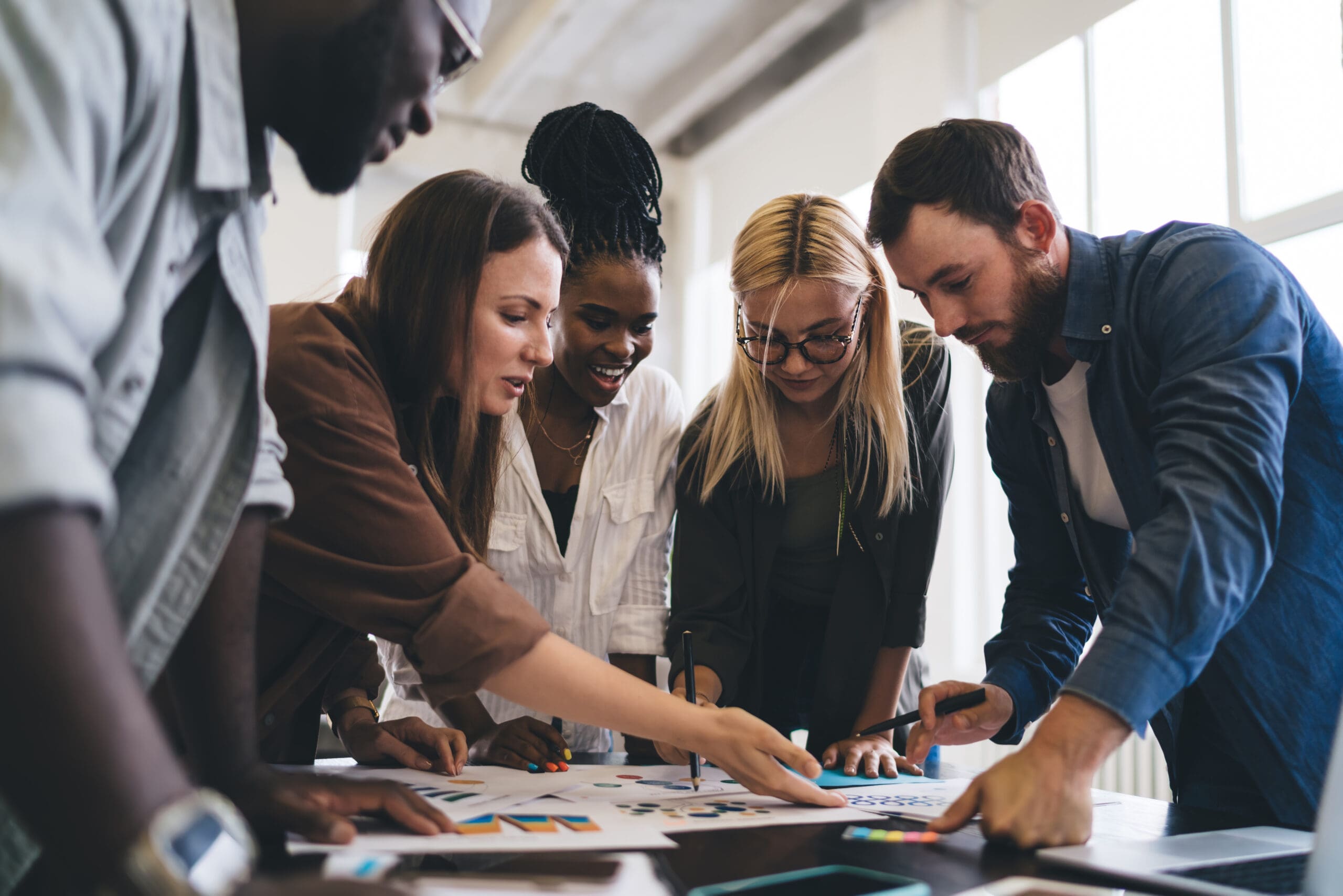 Group of designers working on project in office